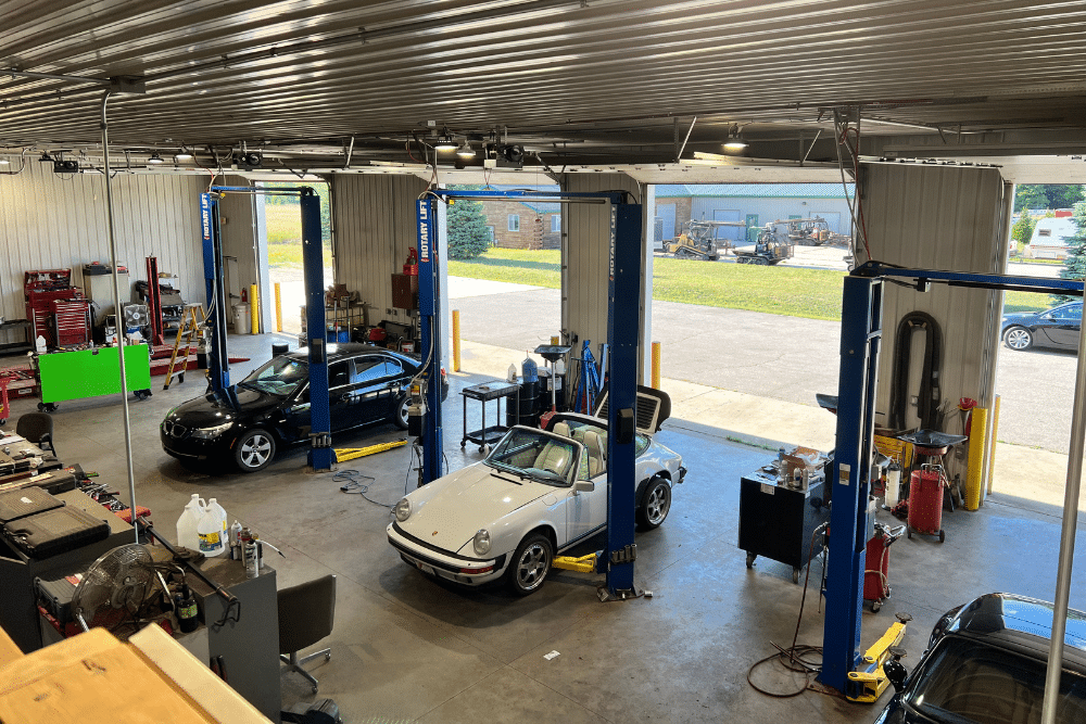 From a Toolbox in a Trunk to Top-Tier Diagnostics: Celebrating Over 20 Years of Integrity Import Service. Vehicles being serviced inside the Integrity Import Service auto repair shop in Grawn, MI.