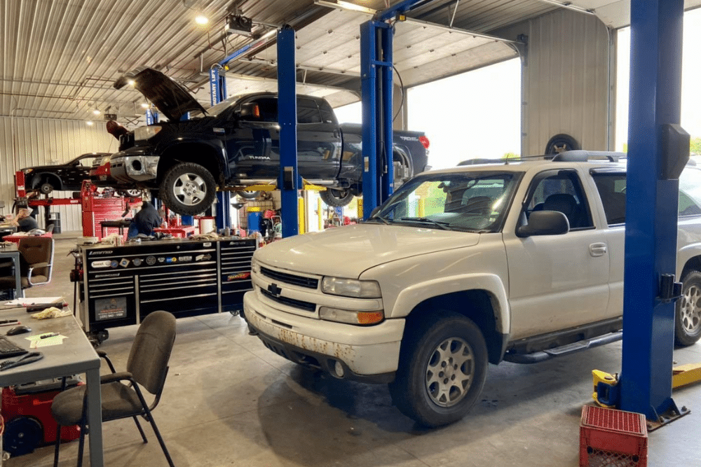 Domestic Auto Repair in Traverse City, MI at Integrity Import Service. Image of trucks and SUVs inside an auto repair shop bay